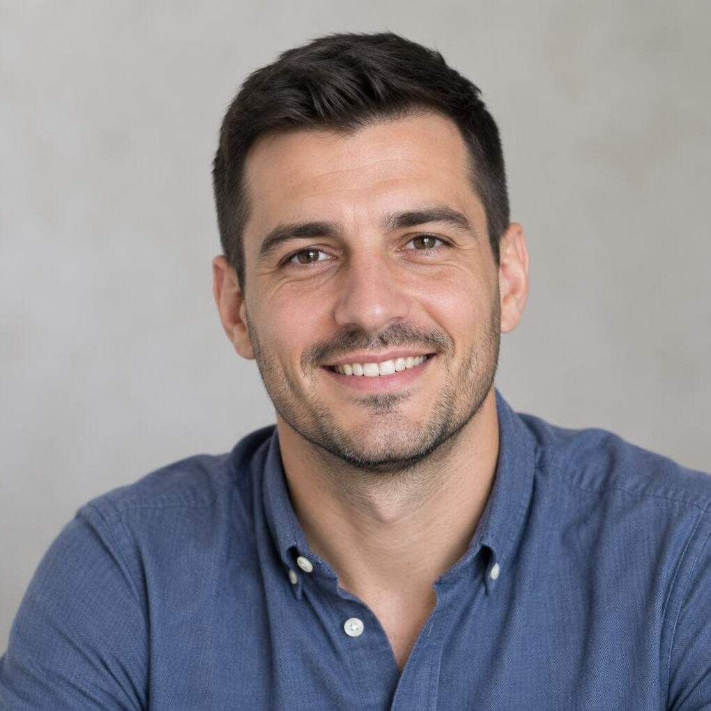 Portrait of a smiling man with short dark hair